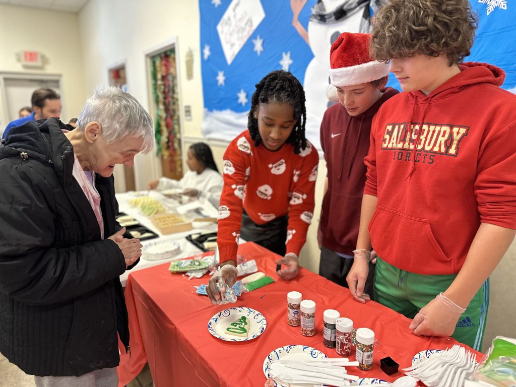 Festive Stewardship and Connection: Salisbury Academy middle school students throw Christmas party for Rowan Vocational Opportunities clients